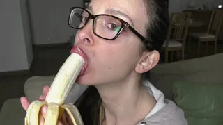 Nerdy girl teases and eats banana