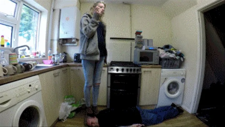 Chelsea's Head Standing In The Kitchen In Black High Heels