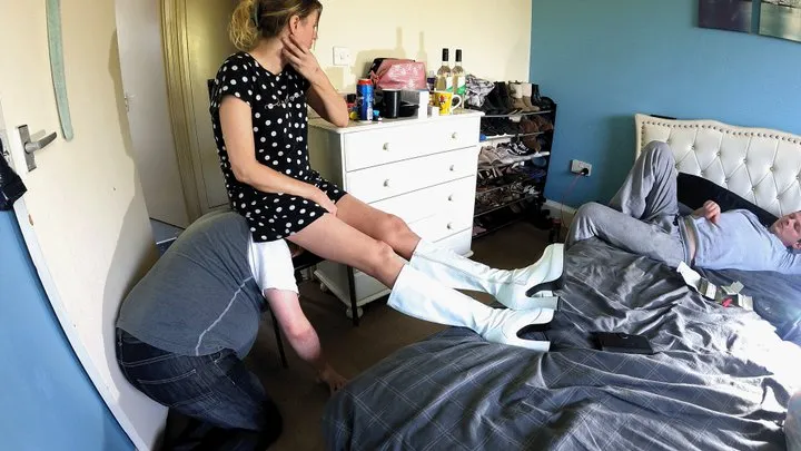 Sitting On His Head On The Chair With Her Feet Up On The Bed