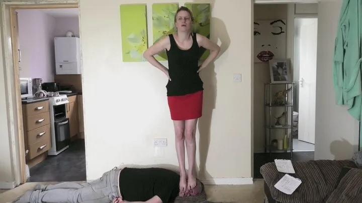 Bare Foot Head Standing In A Red Skirt