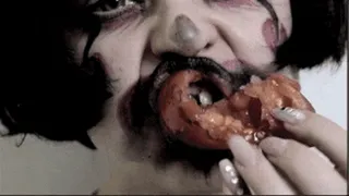 Evil Clown Eating Tomato