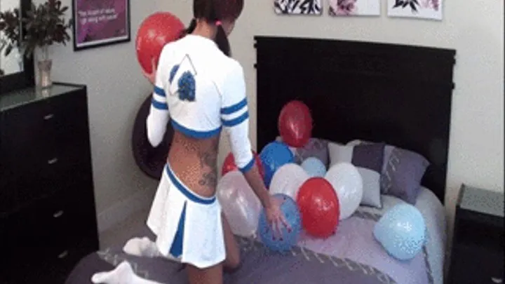 Cheerleader Danica pops ballons!