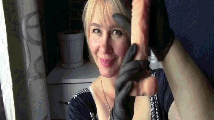 Masturbation of the penis in black styrene gloves