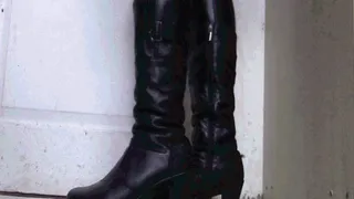 My feet in leather boots tapping out loud heels