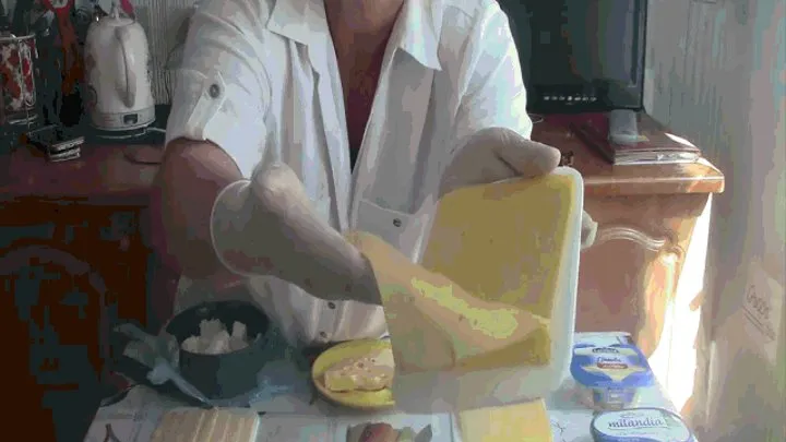 The seller of cheese in latex gloves.