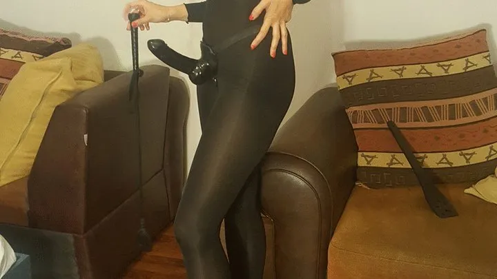 The black catsuit and her new strap-on by Mistress Antonella