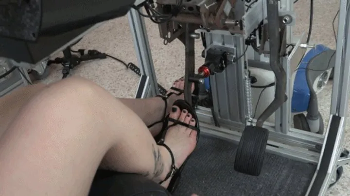 Rae Evaluates a Variety of Black Sandals for Driving in the Simulator