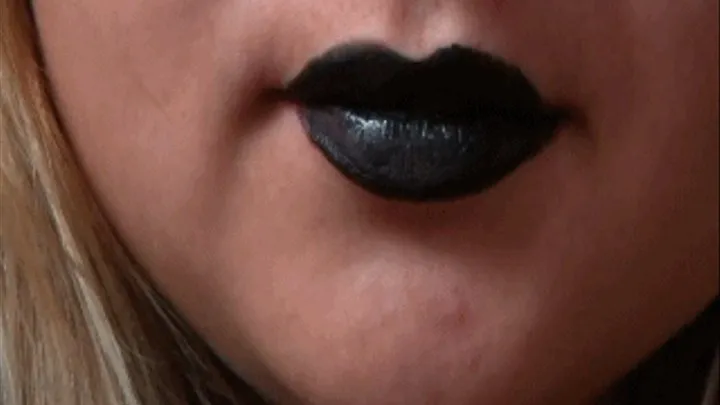 Black lipstick on lips and sharp teeth a