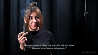 Alina is giving an interview while smoking 100mm cigarette at the smoking studio