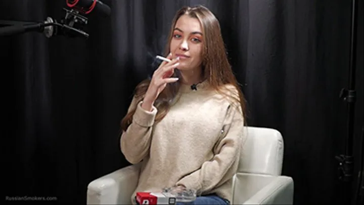 Ksenia is smoking cork Marlboro Red