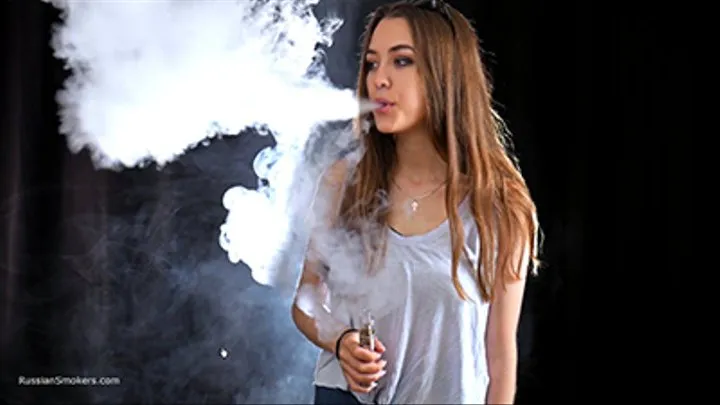 Ksenia is making a lot of nose exales while smoking vape