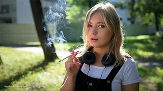 Sweet Polina is smoking 120mm cork cigarettes in the park