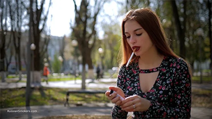 Talking to Christine while she is smoking 120mm Saratoga sitting on the bench in the park