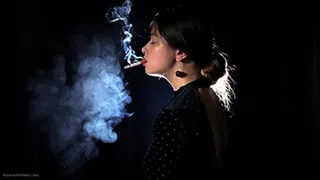 Irina is smoking 100mm cigarette in the dark room