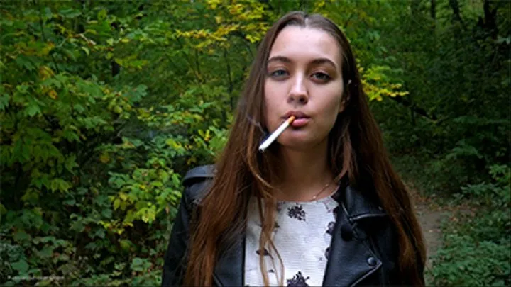 Cute smoker Ksenia enjoys her walk with a cigarette