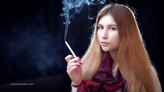 Mysterious girl Valya poses on camera with a tasty 120mm cigarette