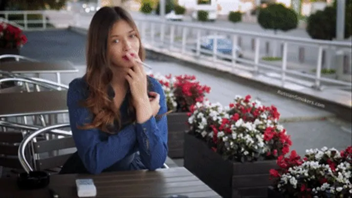 Gorgeous lady Irina having a cookie, coffee and a 120mm cigarette for lunch