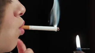 A young lady showing her smoking skills in a closeup video