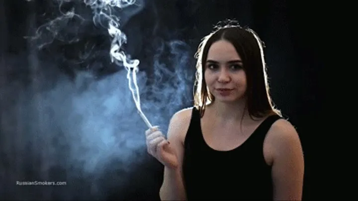 Pretty girl Dasha is taking her time smoking a 100 mm Marlboro Red