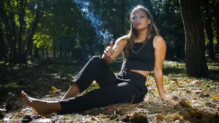 Smoking two reds in the park barefoot