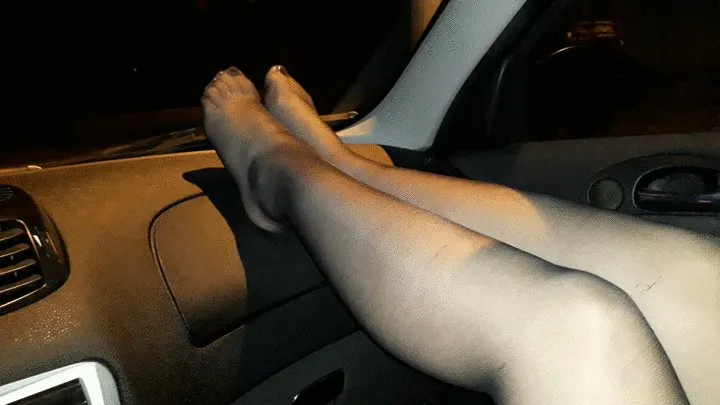 Sandy's nylon feet on the dashboard