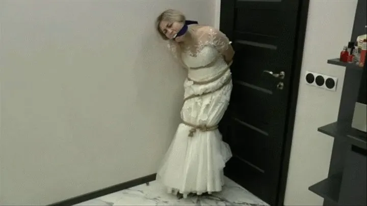 Gagged wearing a wedding dress