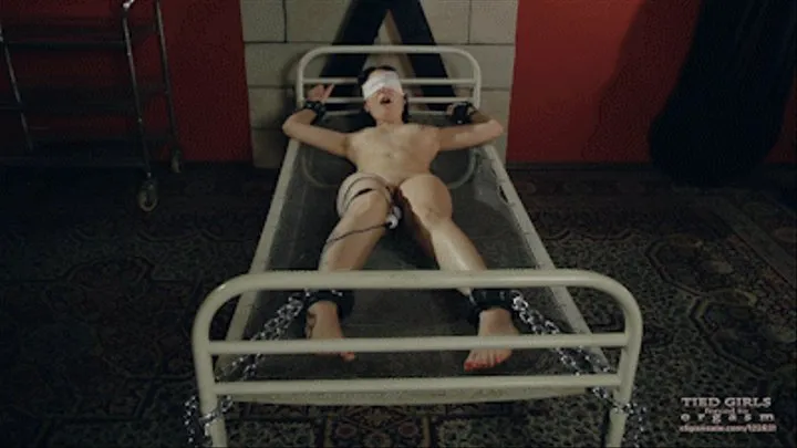 Blindfolded on the metal bed