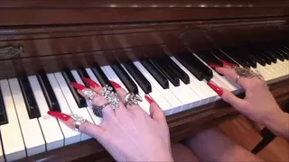 long red fingernails playing piano - full clip (*mp4)