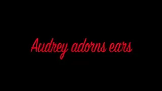 Audrey Adorns her ears