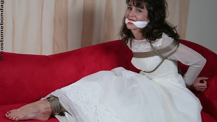 Barefoot bride Karina Santos struggles desperately after she's trussed up in her wedding gown and cleave-gagged!