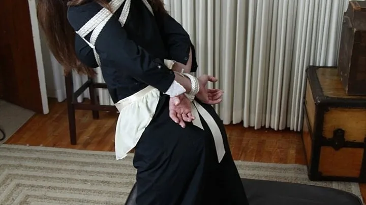 Innocent maid Holly Manning is disciplined with bondage that leaves her kneeling tape-gagged and barefoot!