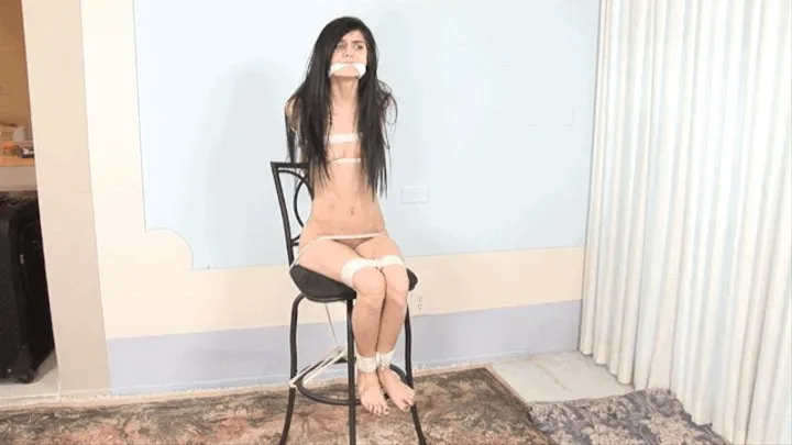 Tiny Chair Tied Cutie Twists in Her Bondage!