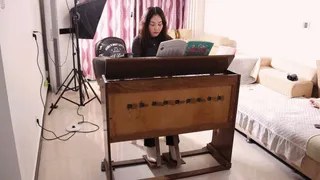 Michelle tramples on the organ in her white boots