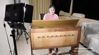 zoe wears high sandals and tramples on the organ
