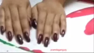 Long Natural Dark Brown Finger Nails on Bed