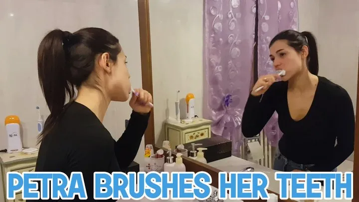 Petra brushes her teeth