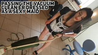Passing the vacuum cleaner dressed as a sexy maid