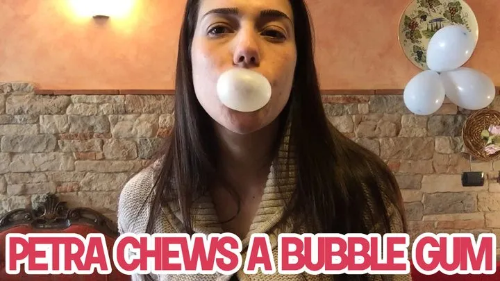 Petra chews a bubble gum