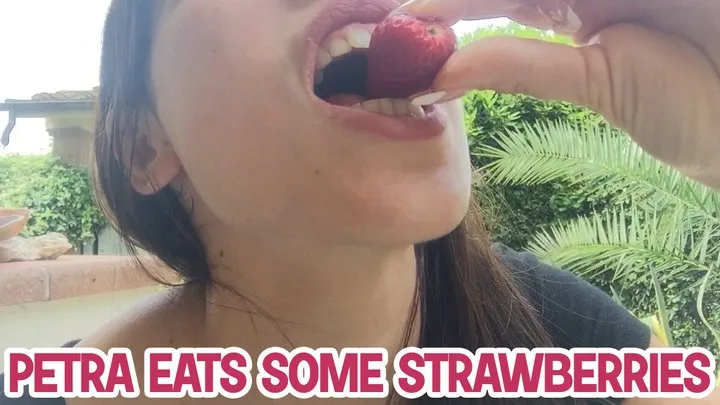 Petra eats some strawberries