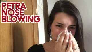 Petra blows her nose