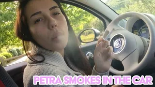 Petra smokes in the car