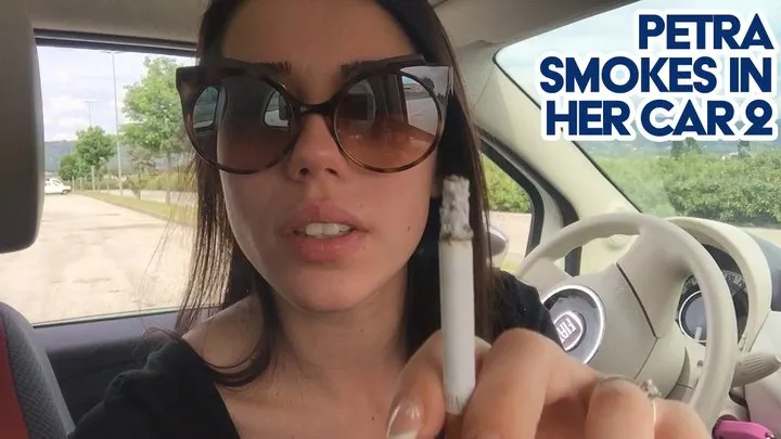 Petra smokes in her car 2