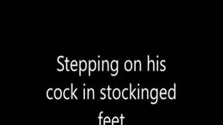 Stepping on his cock in stockinged feet