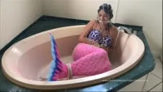 Mermaid caught in a net gets taken home and put in a tub