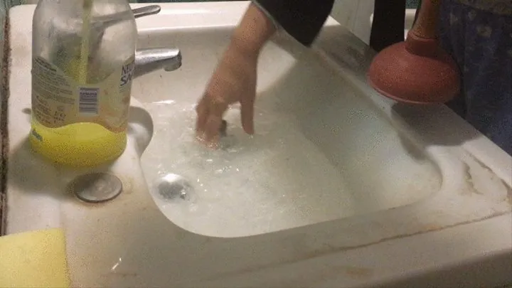 Unclogging the sink with two plungers