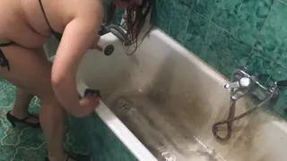 Unclogging the bathtub wearing a bikini,making a lot of water noises!