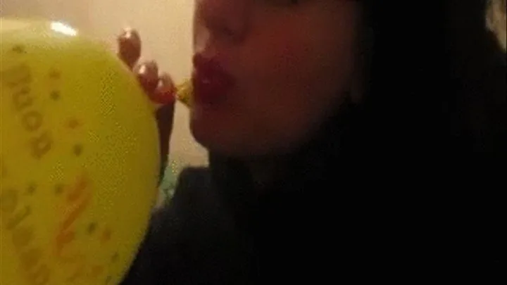 Blowing a big balloon and then popping it!