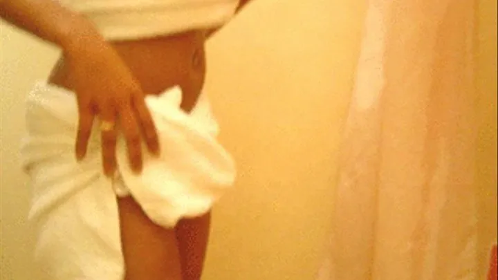 Busty black debutante Jane takes a shower at the hotel