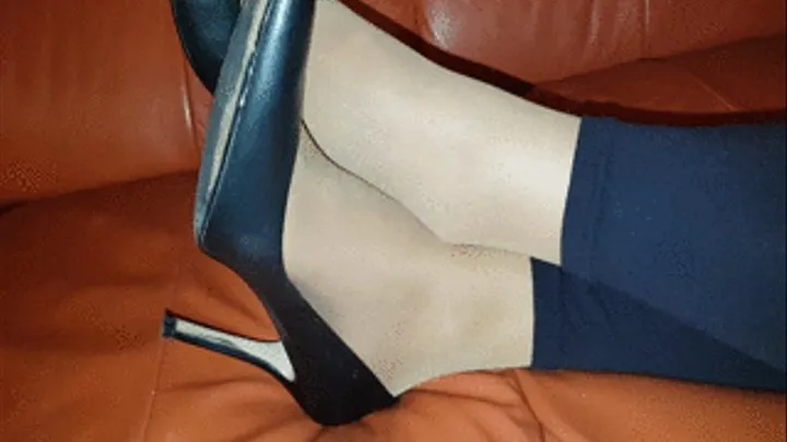 My sweaty nyloned feet in leggings and high-heels.