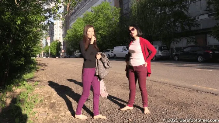 Young and mature barefoot sisters Alexandra and Natalya walks in the city (Part 2 of 6)